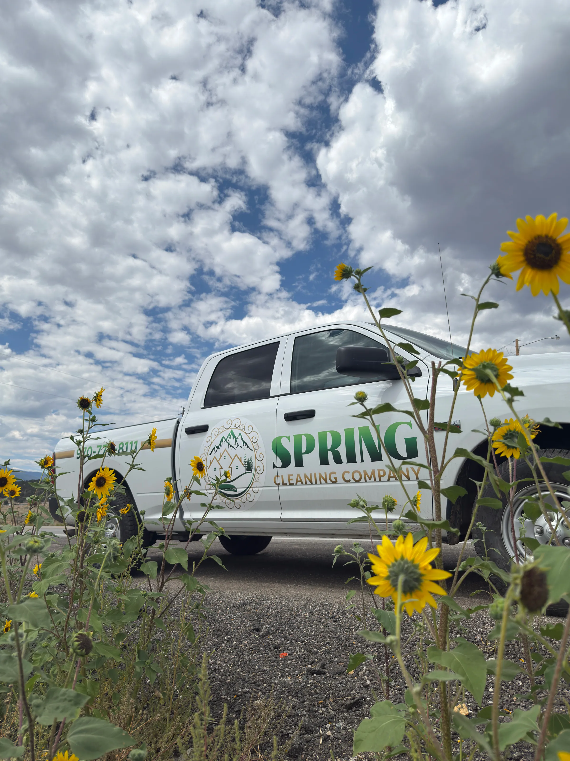 Spring Cleaning Company truck with flowers - eco-friendly cleaning and junk removal services in Summit County Colorado