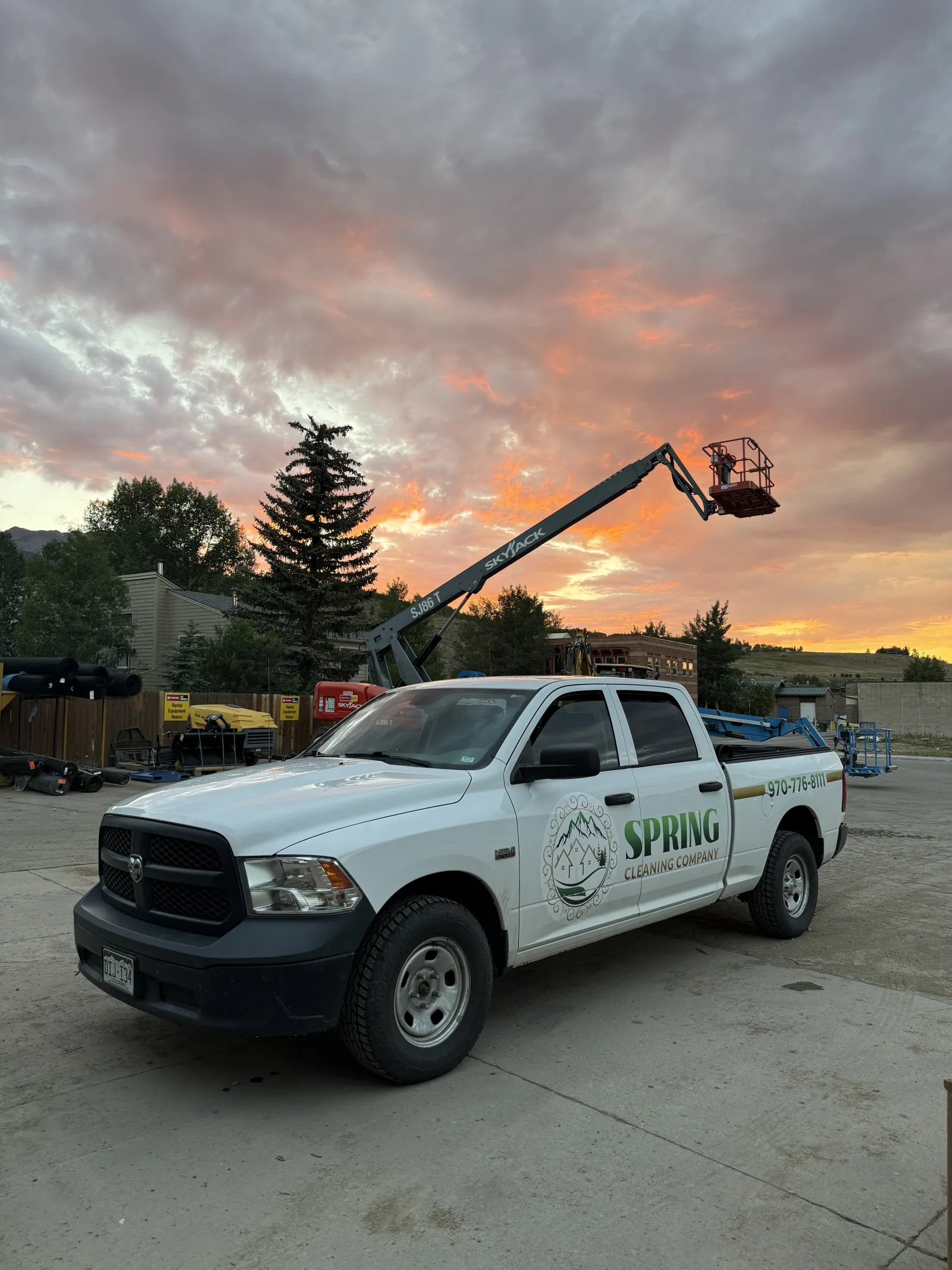 Spring Cleaning Company truck and lift at sunset in Summit County Colorado